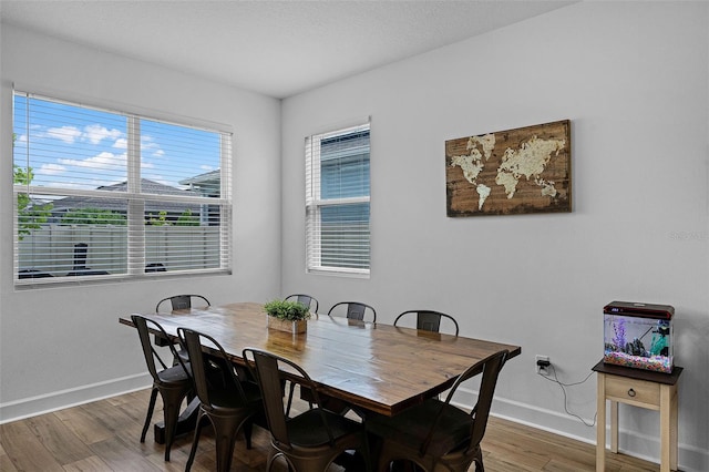 2936 Wild Mulberry Dr, Clermont, FL 34711 - dining area featuring wood finished floors and baseboards