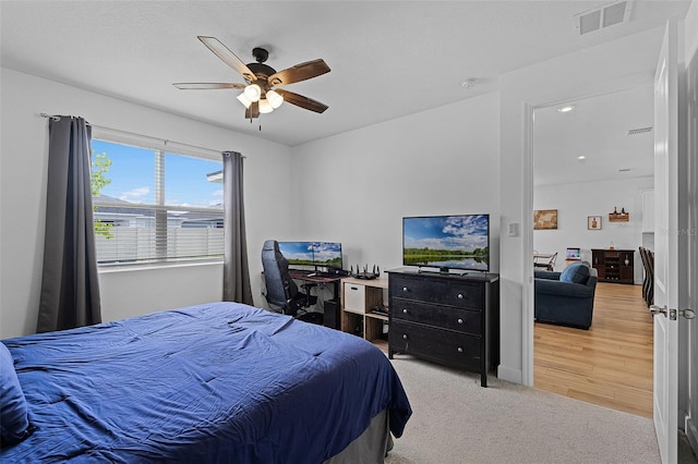 2936 Wild Mulberry Dr, Clermont, FL 34711 - bedroom with ceiling fan, light carpet, and an office area