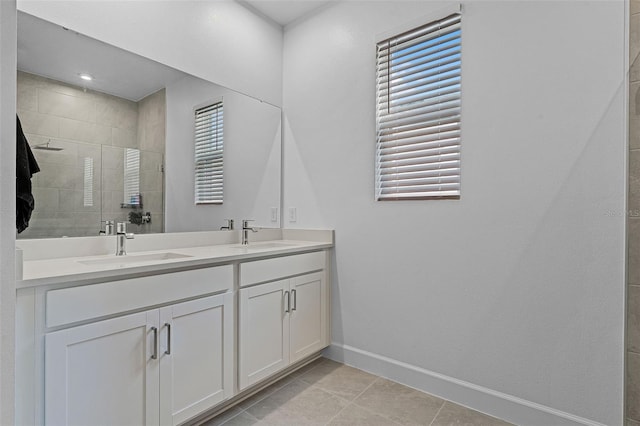 2936 Wild Mulberry Dr, Clermont, FL 34711 - bathroom with double vanity, a tile shower, and tile patterned floors