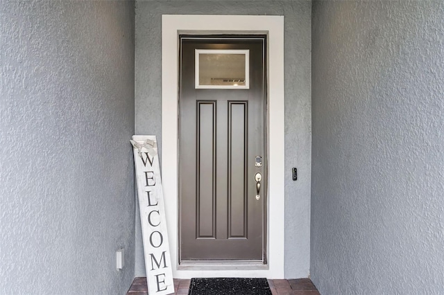 2936 Wild Mulberry Dr, Clermont, FL 34711 - property entrance featuring stucco siding
