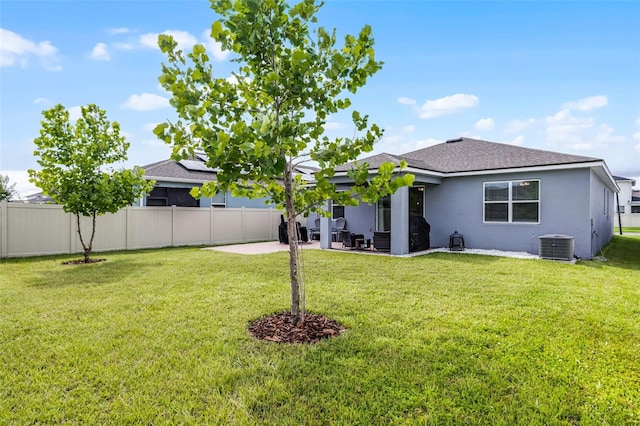 2936 Wild Mulberry Dr, Clermont, FL 34711 - rear view of house featuring stucco siding, a patio area, and a shingled roof