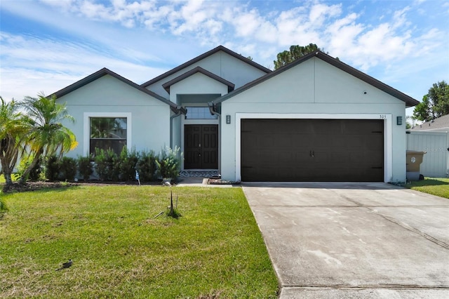 305 Chelmsford Ct, Kissimmee, FL 34758 - single story home featuring a front yard, driveway, an attached garage, and stucco siding