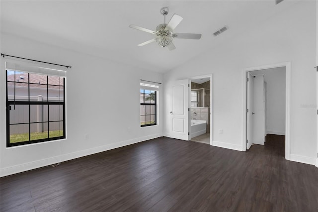 305 Chelmsford Ct, Kissimmee, FL 34758 - unfurnished bedroom featuring dark wood-style flooring, lofted ceiling, a spacious closet, a ceiling fan, and ensuite bathroom