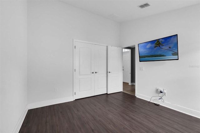 305 Chelmsford Ct, Kissimmee, FL 34758 - unfurnished bedroom featuring wood finished floors and baseboards