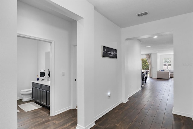 17242 Hickory Wind Dr, Clermont, FL 34711 - corridor with dark wood-type flooring and recessed lighting