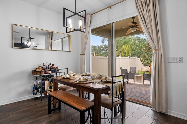 17242 Hickory Wind Dr, Clermont, FL 34711 - dining area with ceiling fan, a chandelier, and wood finished floors