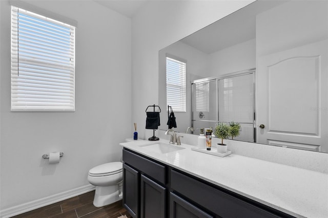 17242 Hickory Wind Dr, Clermont, FL 34711 - full bath featuring wood finished floors, a shower with door, and vanity
