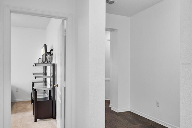 17242 Hickory Wind Dr, Clermont, FL 34711 - hallway with baseboards and wood finished floors