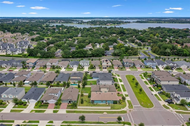 17242 Hickory Wind Dr, Clermont, FL 34711 - aerial view of property and surrounding area with nearby suburban area and a large body of water