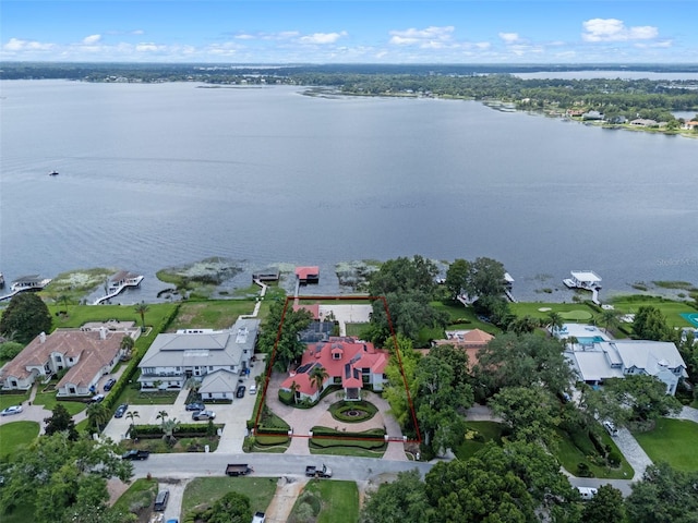 10545 Down Lakeview Cir, Windermere, FL 34786 - aerial view of property and surrounding area featuring property boundaries highlighted, a large body of water, and nearby suburban area