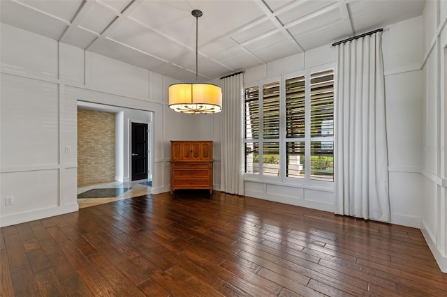 10545 Down Lakeview Cir, Windermere, FL 34786 - unfurnished dining area featuring coffered ceiling, hardwood / wood-style flooring, and a decorative wall