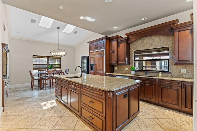 10545 Down Lakeview Cir, Windermere, FL 34786 - kitchen with a skylight, stone tile floors, backsplash, paneled built in refrigerator, and lofted ceiling
