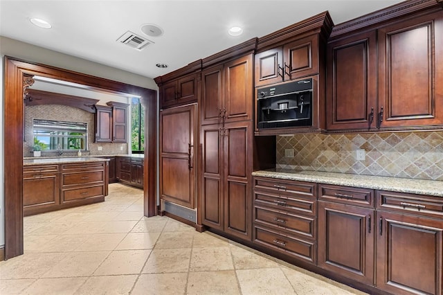 10545 Down Lakeview Cir, Windermere, FL 34786 - kitchen featuring tasteful backsplash, recessed lighting, and light stone counters