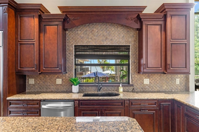 10545 Down Lakeview Cir, Windermere, FL 34786 - kitchen with dishwasher, light stone counters, and decorative backsplash