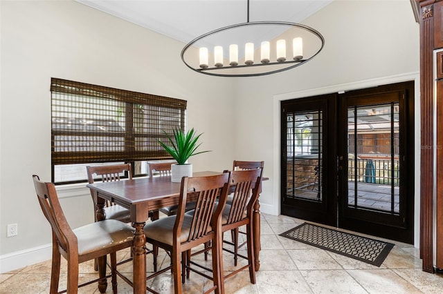 10545 Down Lakeview Cir, Windermere, FL 34786 - dining space featuring french doors and a chandelier