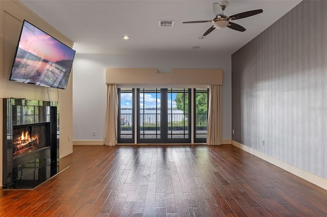 10545 Down Lakeview Cir, Windermere, FL 34786 - unfurnished living room featuring wood finished floors, a fireplace, ceiling fan, and recessed lighting
