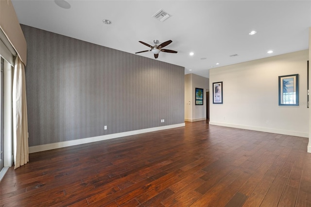 10545 Down Lakeview Cir, Windermere, FL 34786 - unfurnished room with a ceiling fan, an accent wall, dark wood-style flooring, and recessed lighting