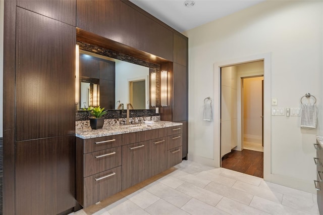 10545 Down Lakeview Cir, Windermere, FL 34786 - bathroom featuring vanity, backsplash, and tile patterned floors