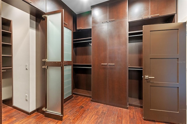 10545 Down Lakeview Cir, Windermere, FL 34786 - spacious closet featuring dark wood finished floors