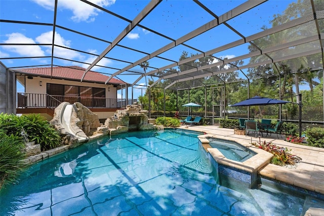 10545 Down Lakeview Cir, Windermere, FL 34786 - view of swimming pool featuring a water slide, a pool with connected hot tub, a patio area, and a lanai