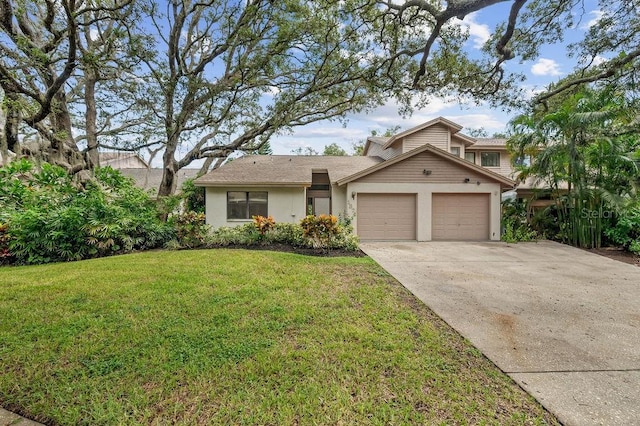 1870 Whispering Way, Tarpon Springs, FL 34689 - view of front facade with an attached garage, driveway, and a front yard