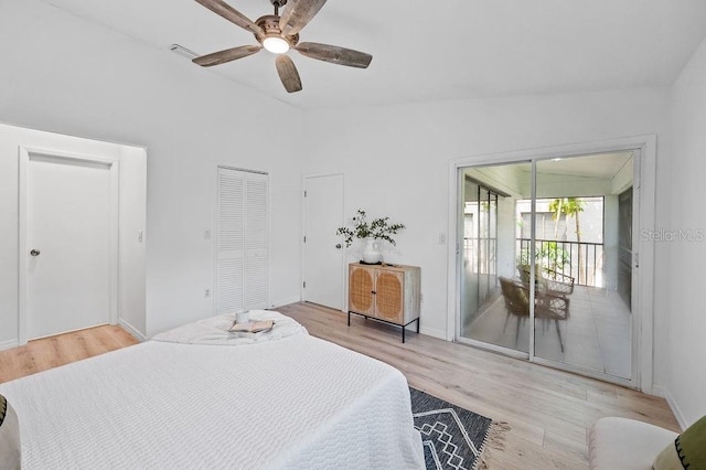 1870 Whispering Way, Tarpon Springs, FL 34689 - bedroom with wood finished floors, ceiling fan, access to outside, and vaulted ceiling