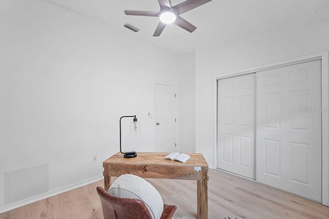 1870 Whispering Way, Tarpon Springs, FL 34689 - office with a ceiling fan, light wood-type flooring, and a textured ceiling