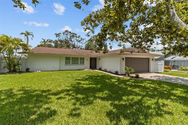 671 25th St SW, Largo, FL 33770 - single story home with an attached garage, concrete driveway, and stucco siding