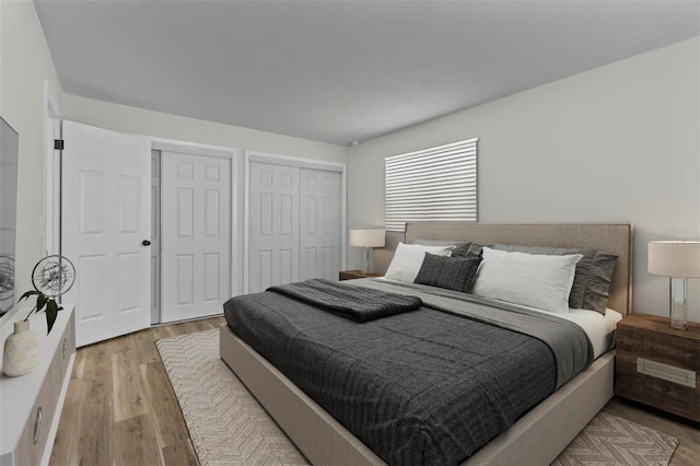 671 25th St SW, Largo, FL 33770 - bedroom featuring multiple closets and light wood-type flooring