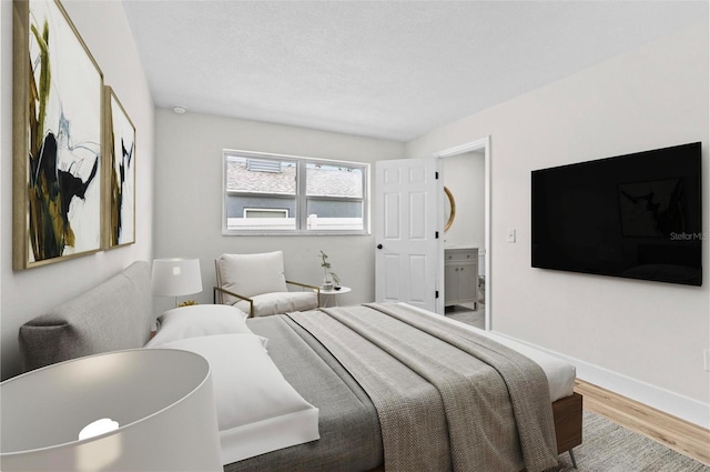 671 25th St SW, Largo, FL 33770 - bedroom featuring wood finished floors and baseboards