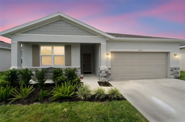 4021 Mayhill Loop, Eustis, FL 32736 - view of front of home with stone siding, an attached garage, driveway, and stucco siding