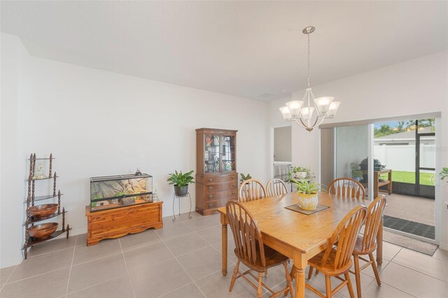 4021 Mayhill Loop, Eustis, FL 32736 - dining area featuring a chandelier and light tile patterned flooring