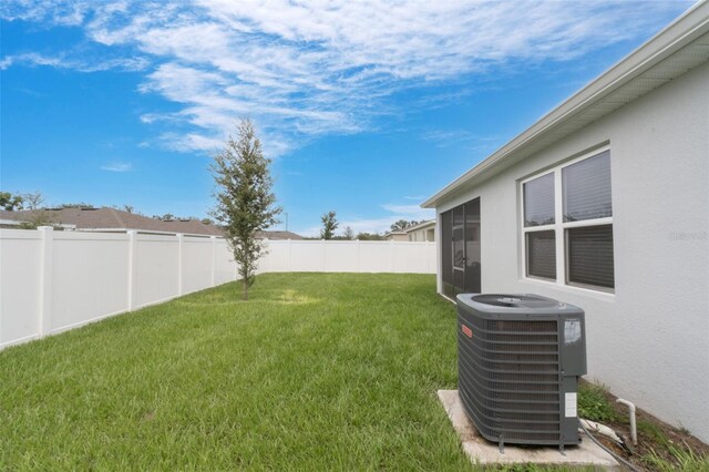 4021 Mayhill Loop, Eustis, FL 32736 - fenced backyard featuring a sunroom