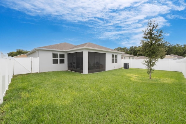 4021 Mayhill Loop, Eustis, FL 32736 - rear view of house with a sunroom, a fenced backyard, stucco siding, and a gate