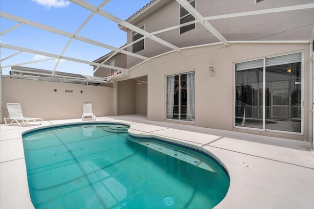 516 Brunello Dr, Davenport, FL 33897 - outdoor pool with a patio, glass enclosure, and ceiling fan