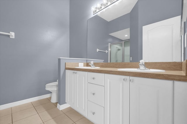 516 Brunello Dr, Davenport, FL 33897 - bathroom featuring a shower stall, double vanity, and tile patterned floors