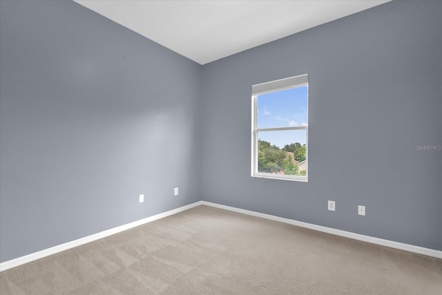 516 Brunello Dr, Davenport, FL 33897 - unfurnished room featuring baseboards and light colored carpet