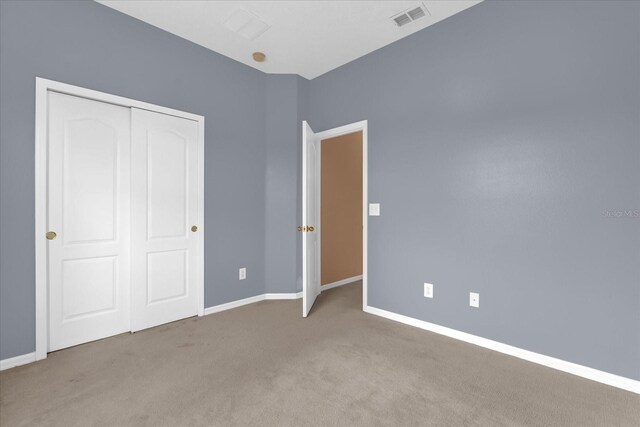 516 Brunello Dr, Davenport, FL 33897 - unfurnished bedroom with carpet flooring and a closet