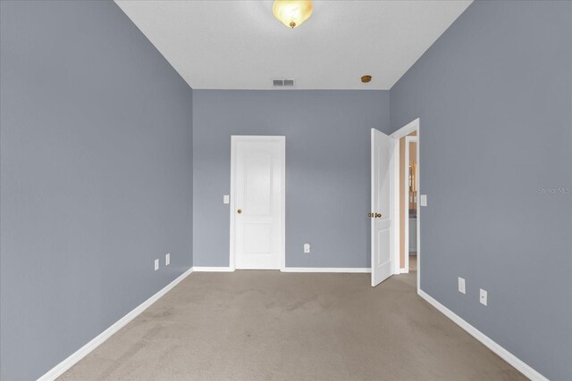516 Brunello Dr, Davenport, FL 33897 - unfurnished bedroom with baseboards and carpet