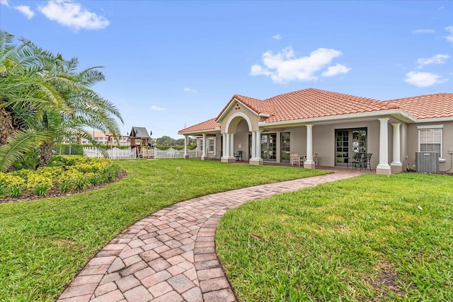 516 Brunello Dr, Davenport, FL 33897 - back of house with stucco siding and a tiled roof