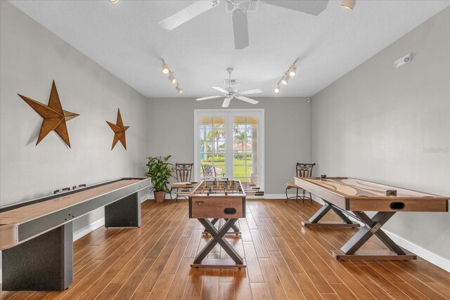 516 Brunello Dr, Davenport, FL 33897 - recreation room with a ceiling fan, rail lighting, and wood finished floors