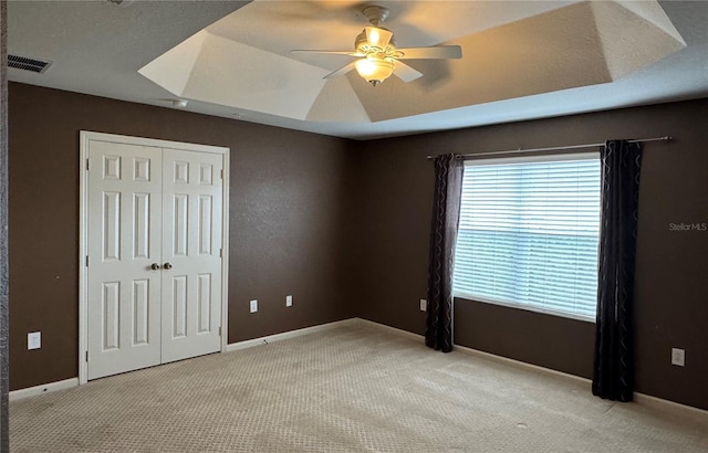 3069 Ashland Ln N, Kissimmee, FL 34741 - unfurnished bedroom featuring a closet, carpet floors, and a ceiling fan