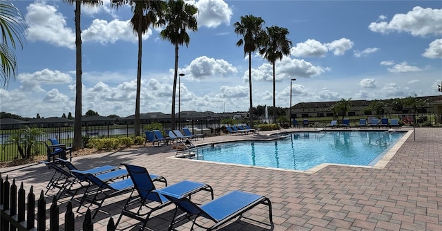 3069 Ashland Ln N, Kissimmee, FL 34741 - community pool featuring a patio area