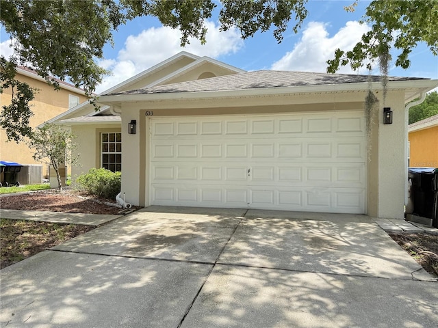 633 Flower Fields Ln, Orlando, FL 32824 - single story home featuring concrete driveway, a garage, and stucco siding