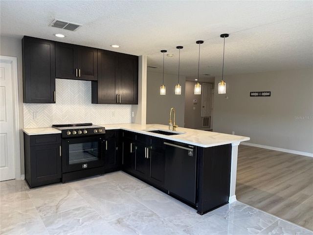 633 Flower Fields Ln, Orlando, FL 32824 - kitchen featuring black appliances, a peninsula, backsplash, hanging light fixtures, and light marble finish floors