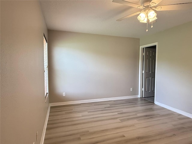 633 Flower Fields Ln, Orlando, FL 32824 - spare room with light wood-type flooring and a ceiling fan