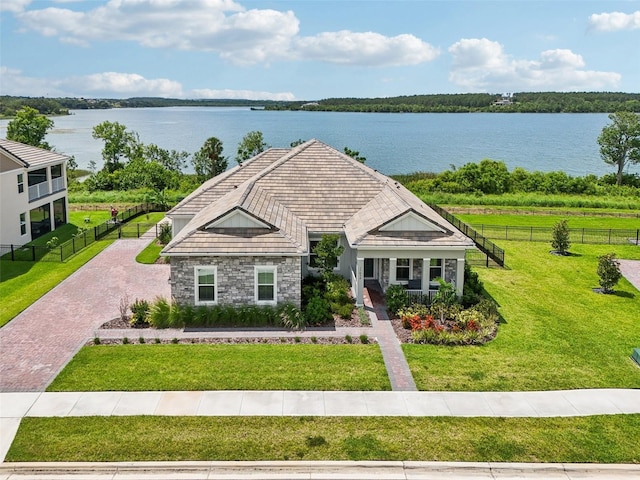 17838 Hither Hills Cir, Winter Garden, FL 34787 - view of front of property featuring stone siding, a water view, and covered porch