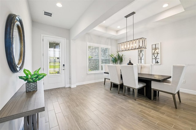 17838 Hither Hills Cir, Winter Garden, FL 34787 - dining space featuring a raised ceiling, wood finished floors, and recessed lighting
