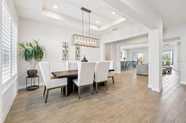 17838 Hither Hills Cir, Winter Garden, FL 34787 - dining area with a raised ceiling, light wood-type flooring, and recessed lighting