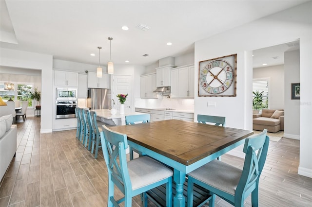 17838 Hither Hills Cir, Winter Garden, FL 34787 - dining area featuring light wood-style floors and recessed lighting